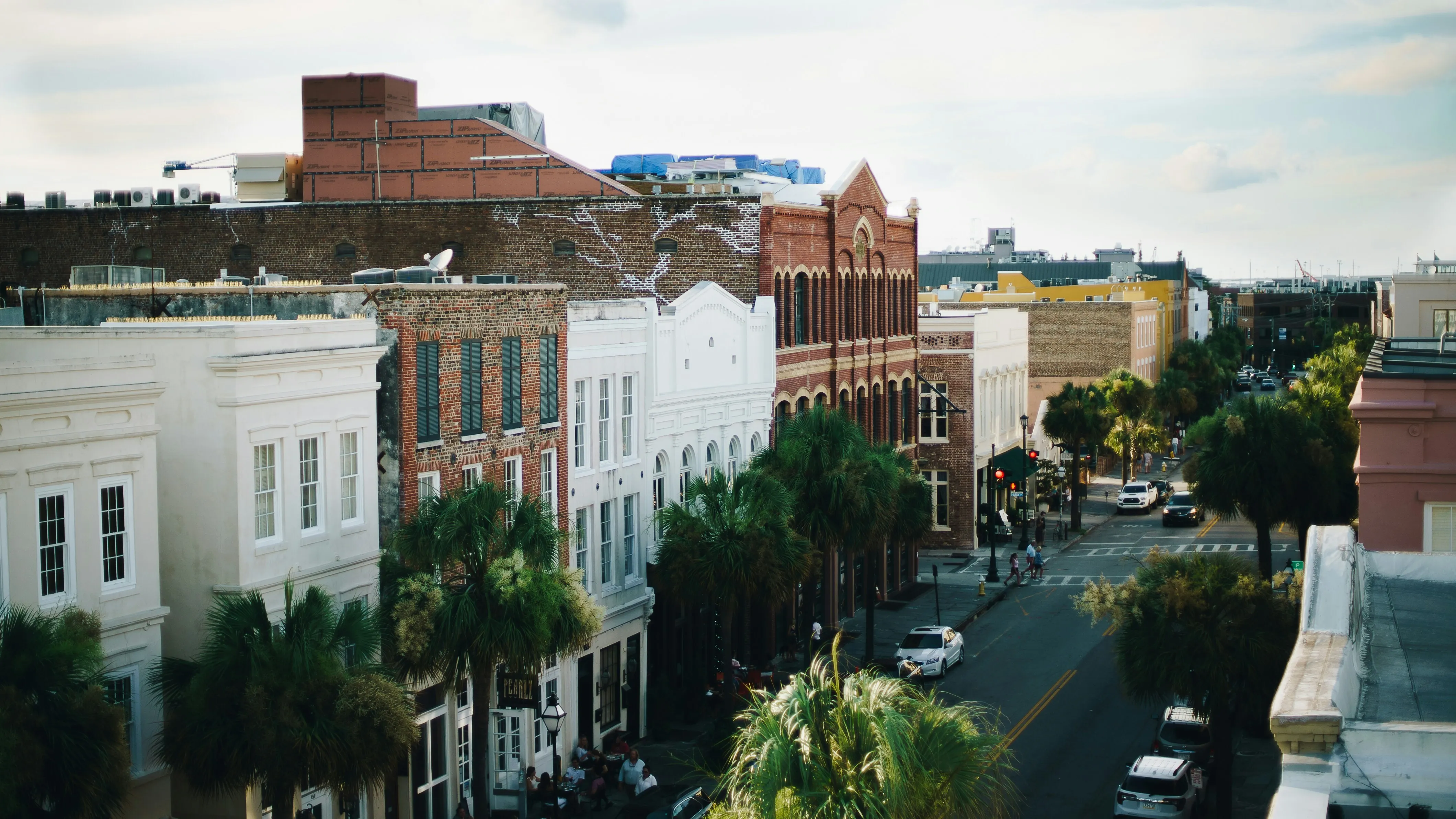 City street scene with historic buildings and palm trees